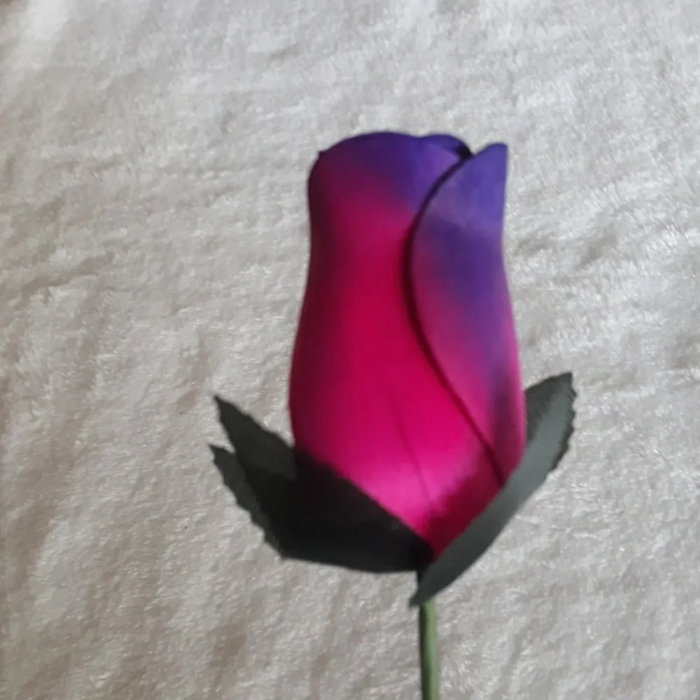 Wooden rose, pink and purple. 13 inches long.